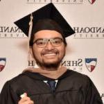 Shenandoah University BBA student Billy Joel Vergara, wearing his graduation robes. 